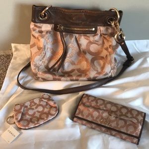 Rose gold COACH purse wallet and coin purse.